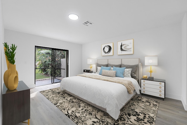 bedroom featuring access to outside and wood-type flooring