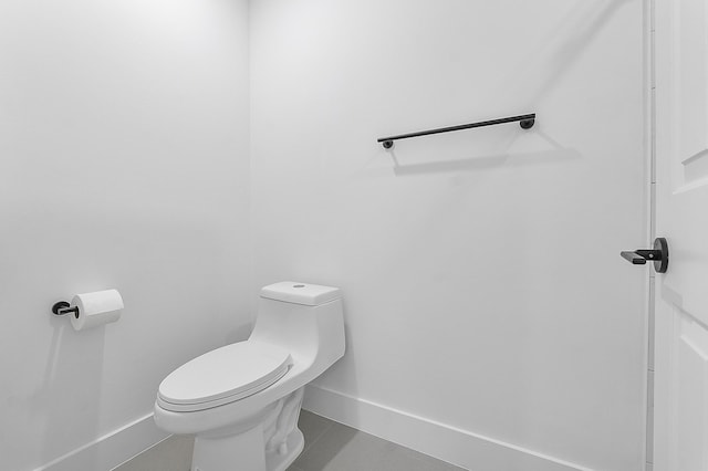 bathroom featuring tile patterned flooring and toilet