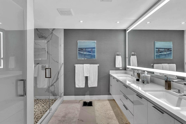 bathroom with tile patterned flooring, vanity, and a shower with shower door