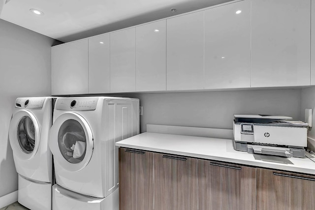 laundry area with independent washer and dryer