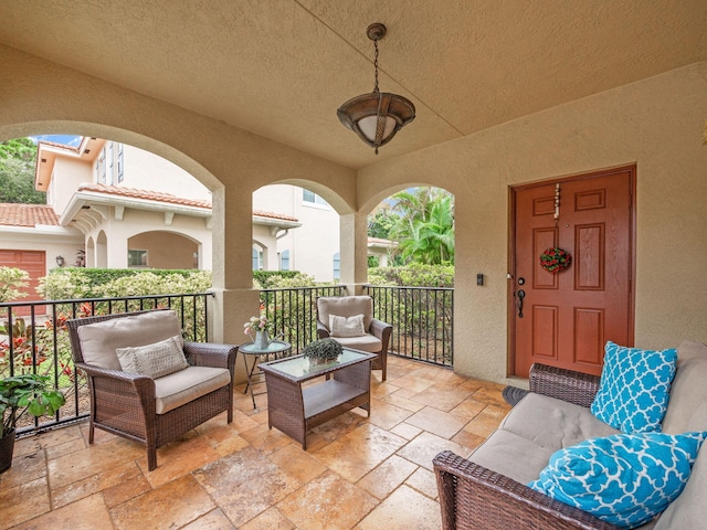 view of patio featuring a balcony