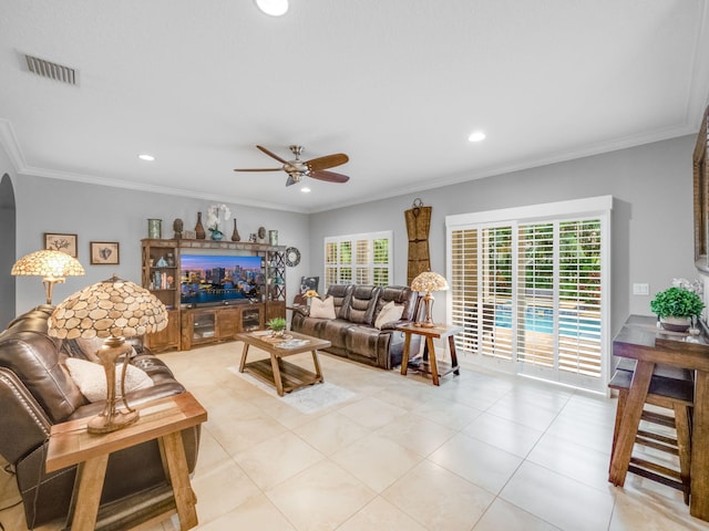 living room with ceiling fan and ornamental molding