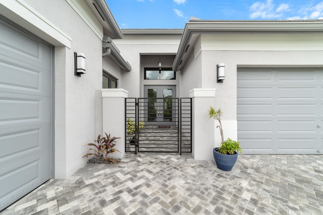 view of exterior entry with a garage