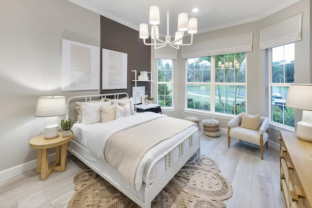 bedroom featuring light hardwood / wood-style floors, multiple windows, and ornamental molding