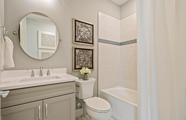 full bathroom with vanity, toilet, and tiled shower / bath combo