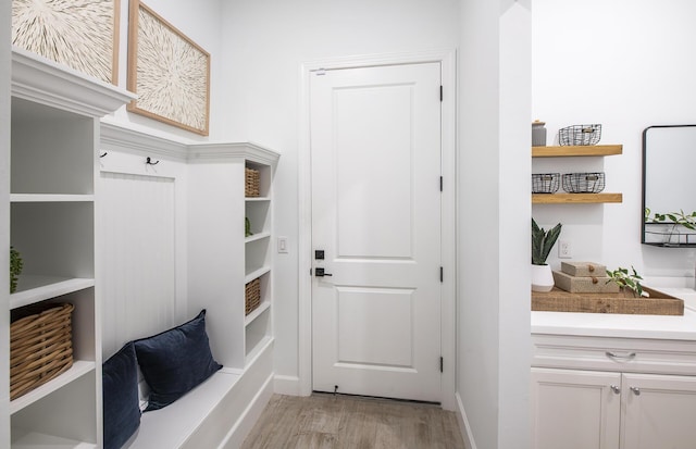 mudroom with light hardwood / wood-style floors