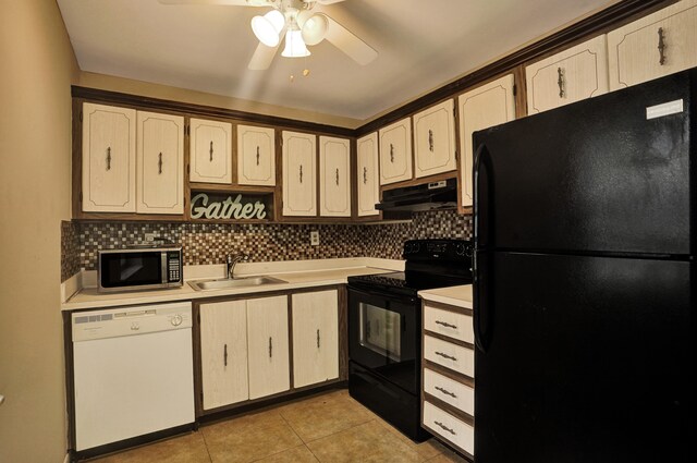 kitchen with backsplash, black appliances, sink, and ceiling fan