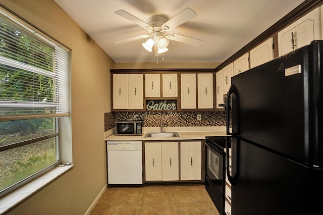 kitchen with ceiling fan, light tile patterned floors, sink, backsplash, and black appliances