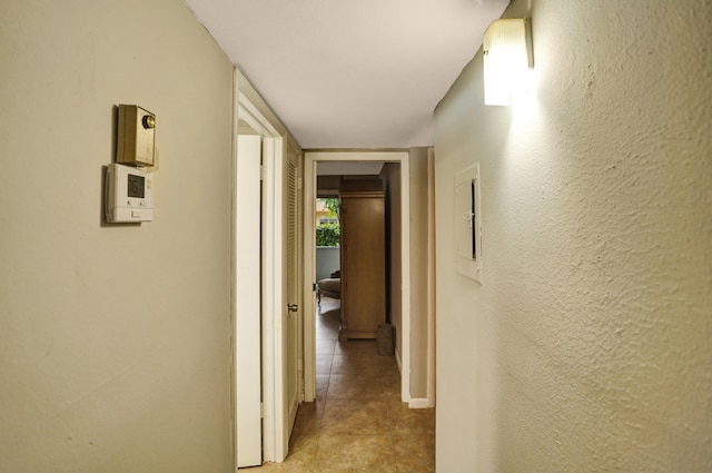 corridor featuring light tile patterned flooring