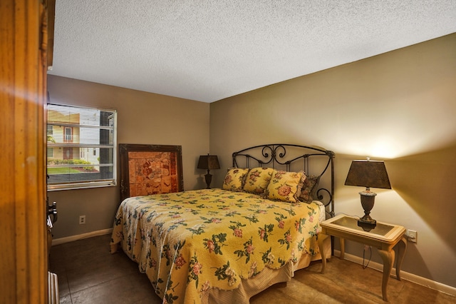 tiled bedroom with a textured ceiling