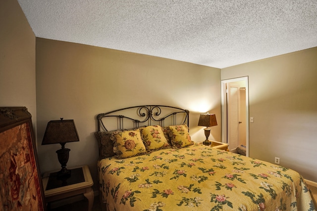 bedroom featuring a textured ceiling