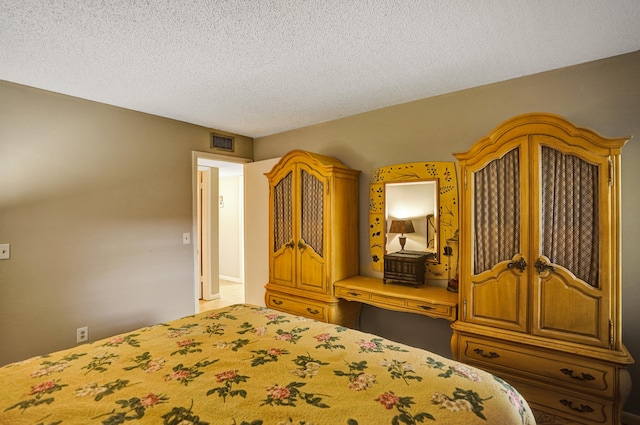 unfurnished bedroom with a textured ceiling