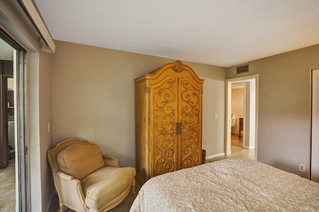 bedroom featuring a textured ceiling