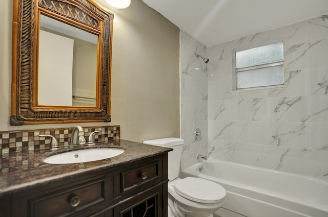 full bathroom featuring tiled shower / bath, vanity, toilet, and decorative backsplash