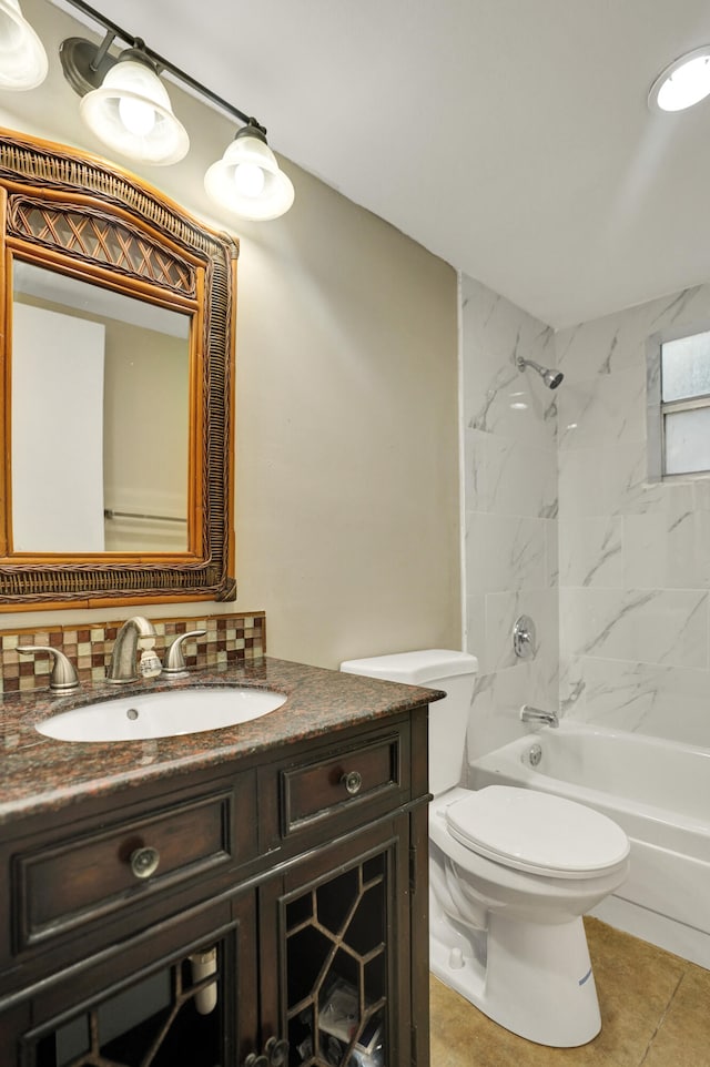 full bathroom with vanity, tiled shower / bath combo, tile patterned flooring, toilet, and decorative backsplash