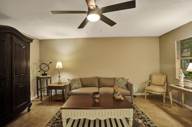 living room with ceiling fan and a textured ceiling