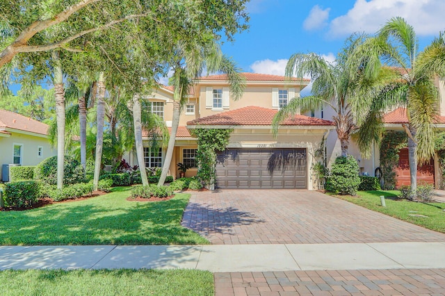 mediterranean / spanish-style house with a front yard