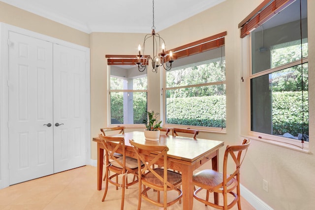 tiled dining space featuring ornamental molding and a notable chandelier