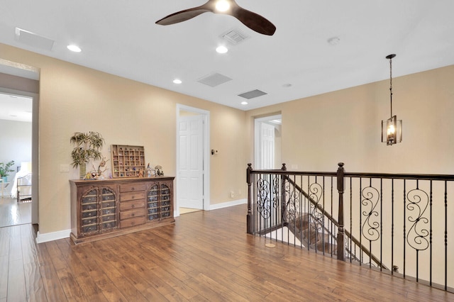 hallway with dark hardwood / wood-style floors