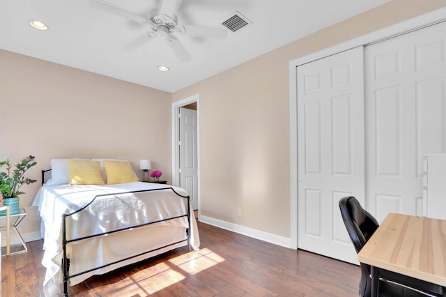 bedroom with a closet, ceiling fan, and dark hardwood / wood-style flooring