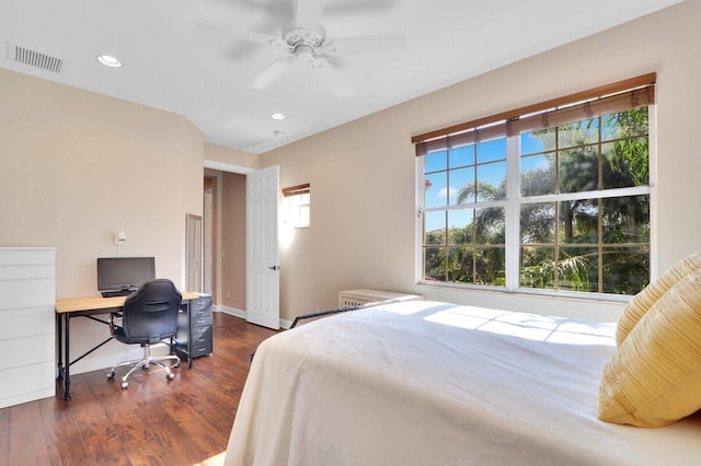 bedroom featuring dark hardwood / wood-style flooring and ceiling fan