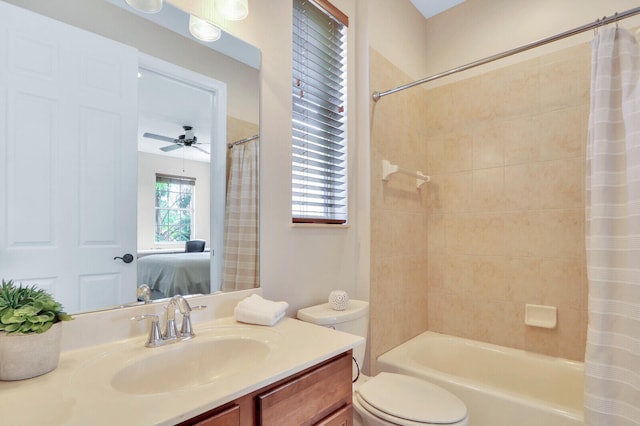 full bathroom featuring vanity, toilet, shower / tub combo, and ceiling fan