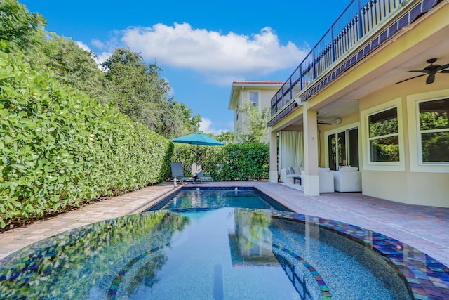 view of pool featuring a patio area and ceiling fan