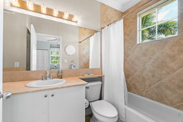 full bathroom with toilet, vanity, ceiling fan, and shower / tub combo with curtain