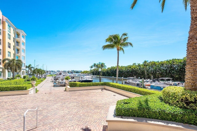 surrounding community featuring a water view