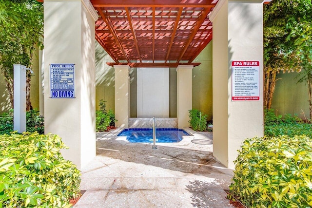 view of swimming pool featuring a pergola