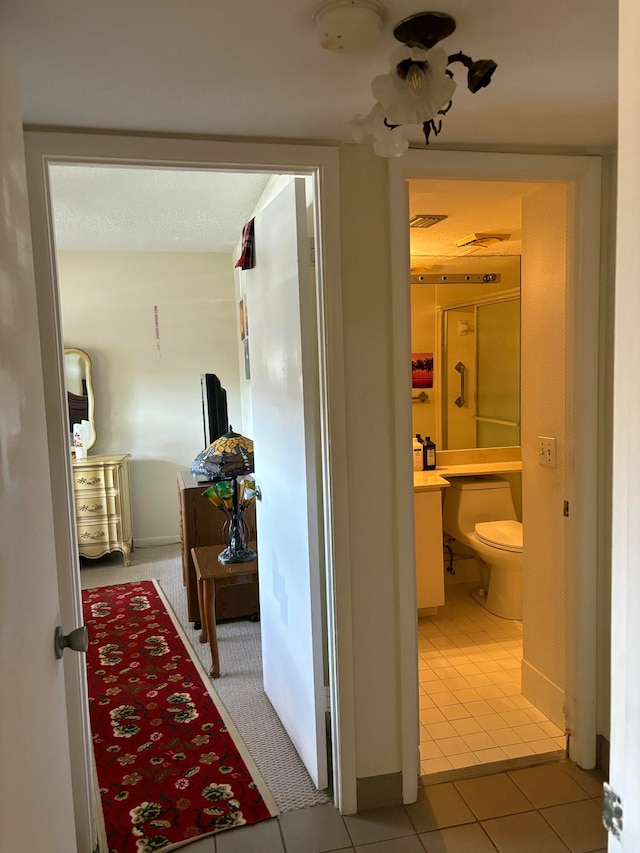 corridor with tile patterned floors