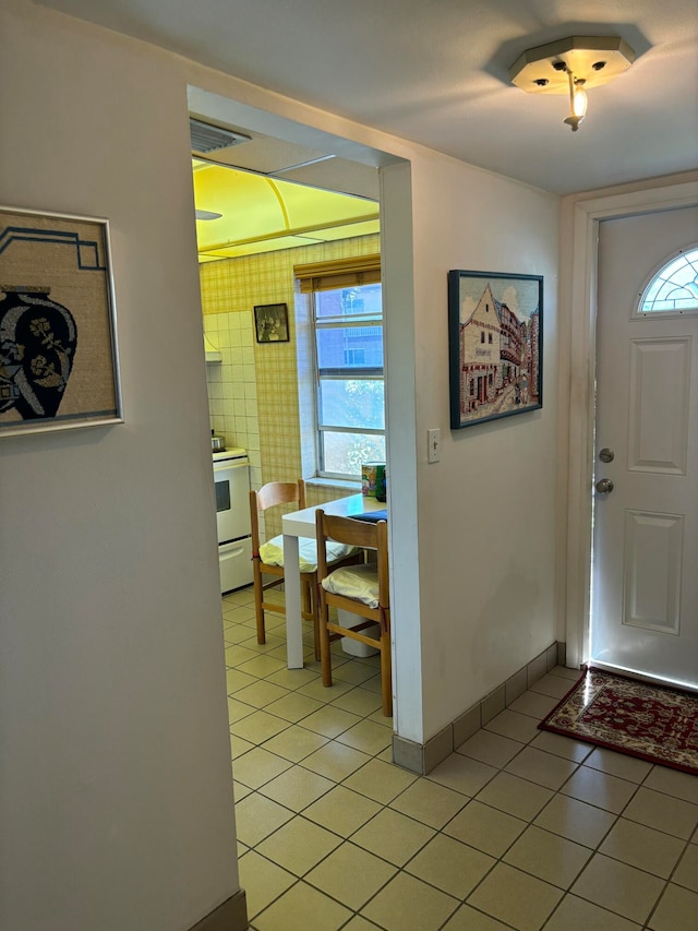 entrance foyer featuring light tile patterned floors