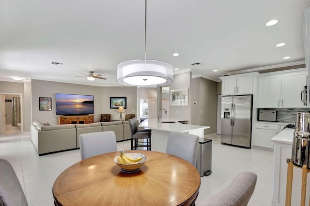 120 Jones Creek Dr, Jupiter, FL 33458 - dining space with recessed lighting, ceiling fan, ornamental molding, and light tile patterned floors