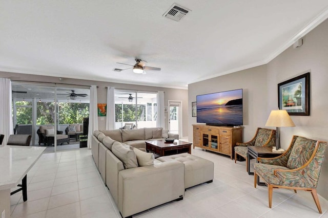 120 Jones Creek Dr, Jupiter, FL 33458 - living room with ceiling fan, visible vents, ornamental molding, and light tile patterned floors