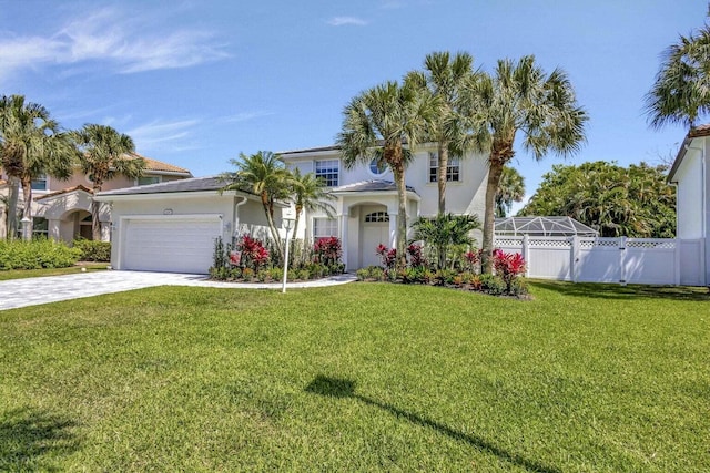 mediterranean / spanish-style house with a lanai, a front lawn, and a garage