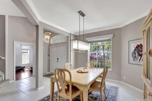 dining room with light tile patterned flooring, crown molding, a wealth of natural light, and an inviting chandelier