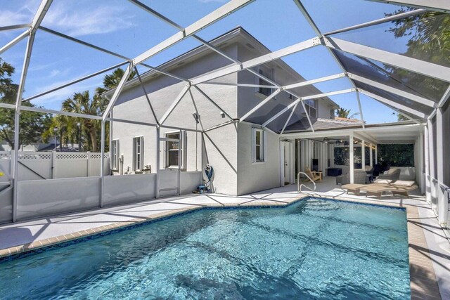 120 Jones Creek Dr, Jupiter, FL 33458 - view of swimming pool with glass enclosure, fence, a fenced in pool, and a patio area