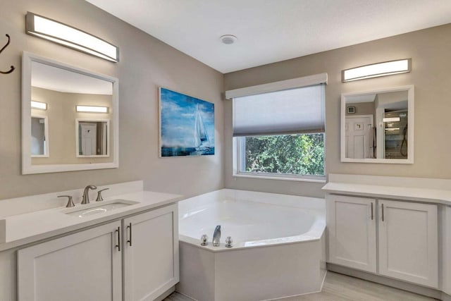 120 Jones Creek Dr, Jupiter, FL 33458 - bathroom featuring vanity and a garden tub