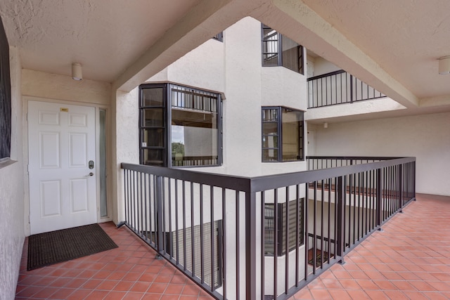 doorway to property featuring a balcony