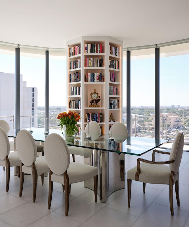 dining area with floor to ceiling windows