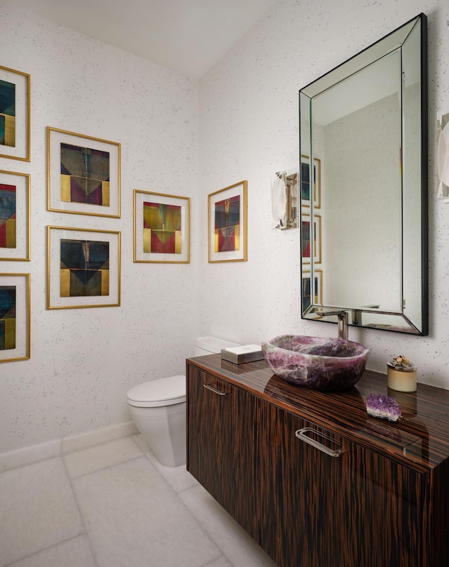 bathroom with tile patterned floors, vanity, and toilet