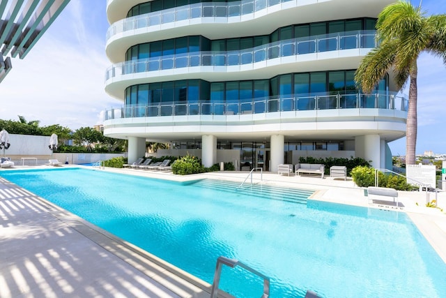 view of pool with outdoor lounge area and a patio area