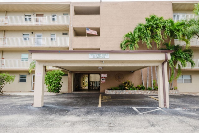 view of building exterior with a carport