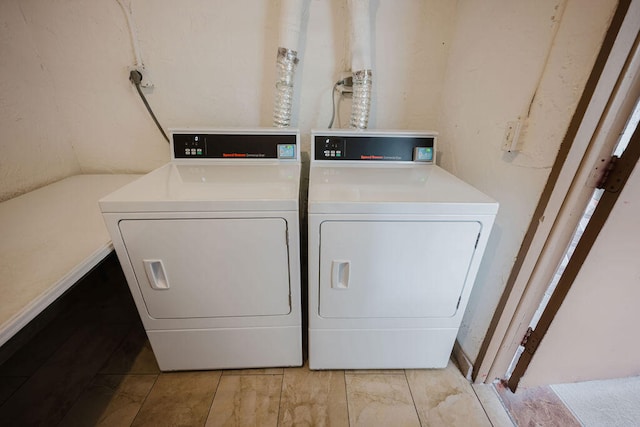 clothes washing area with washer and dryer