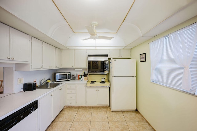 kitchen featuring ceiling fan, white cabinets, light tile patterned floors, sink, and white appliances