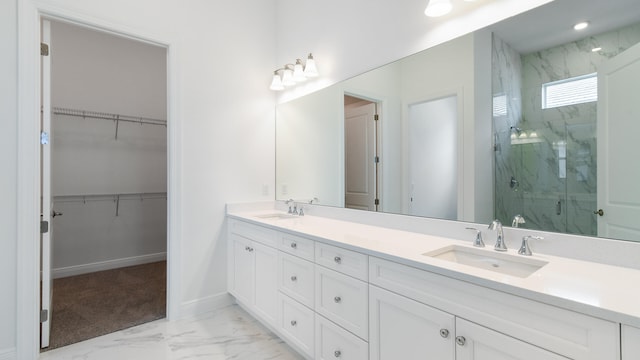 bathroom with vanity and a shower with shower door