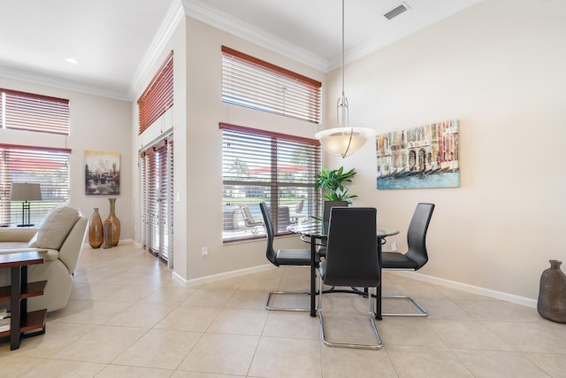 dining room featuring ornamental molding and light tile patterned floors