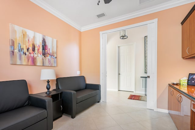 sitting room with light tile patterned flooring and ornamental molding