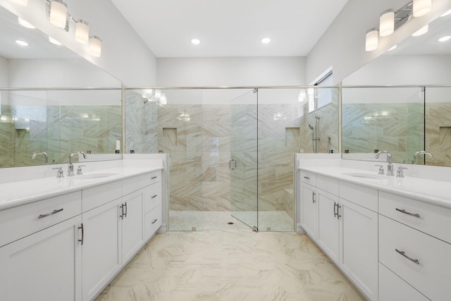 bathroom with vanity and an enclosed shower