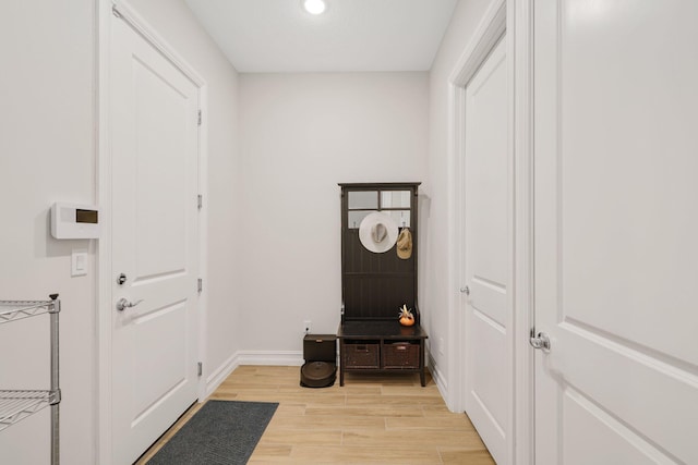 entryway with light hardwood / wood-style floors